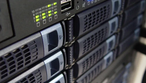 Close-up of rack-mounted servers with green status lights